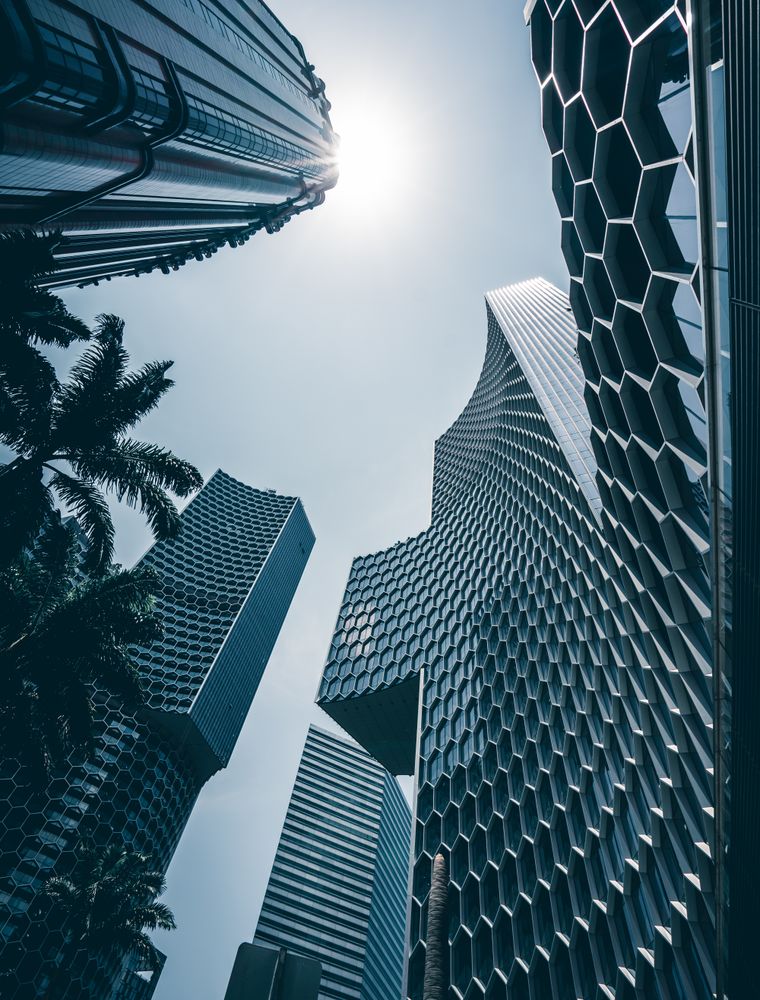 Blue glass skyscrapers viewed from street level