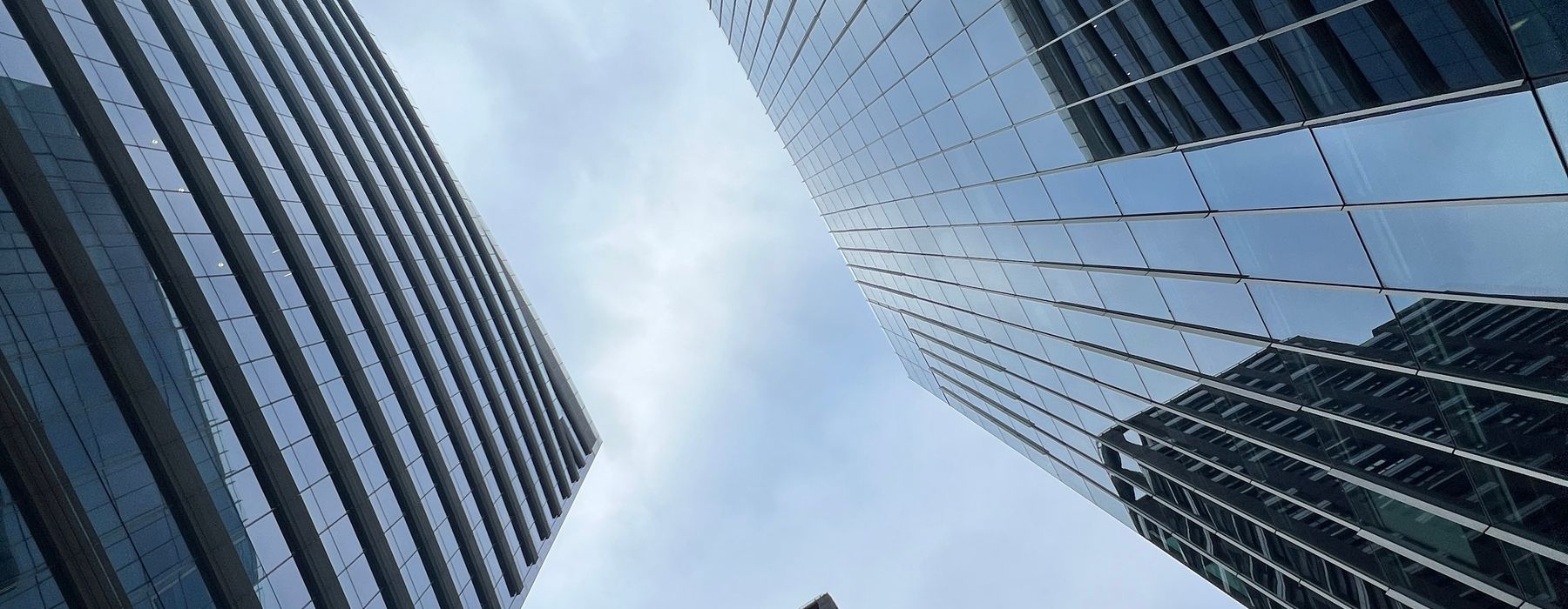 Glass office towers rising against a clear sky